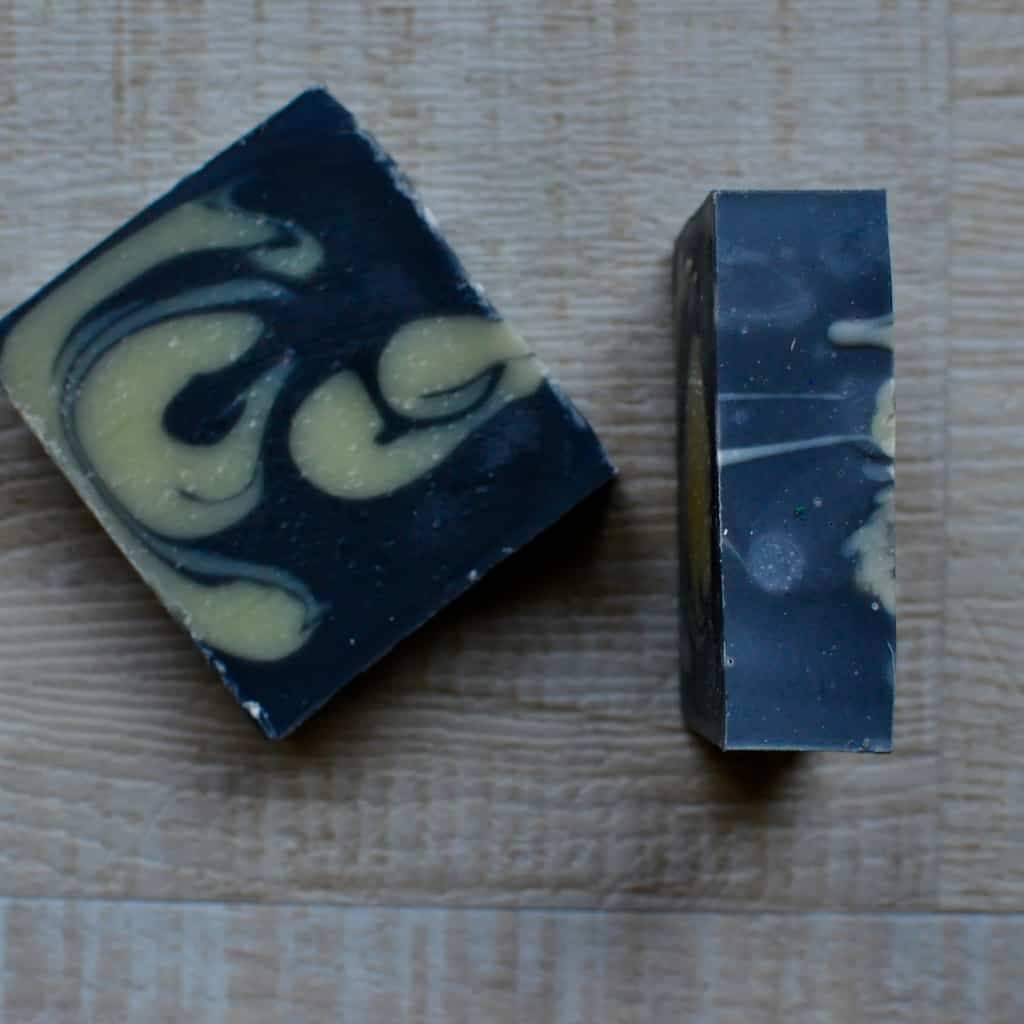 soap charcoal is the base of this handmade bar, it color is black and is 3 by 3 inches