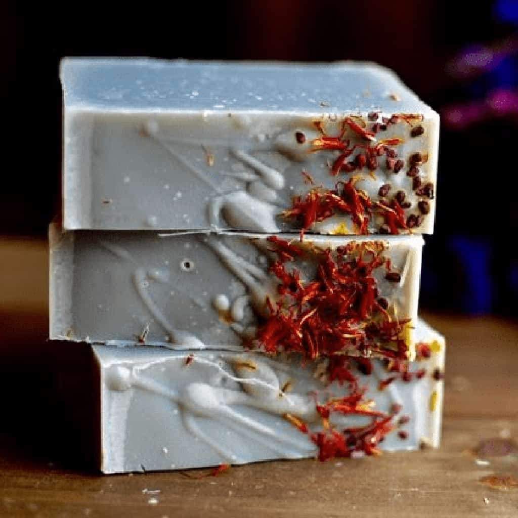 blackberry sage soap topped with safflowers, this is a sage scented soap